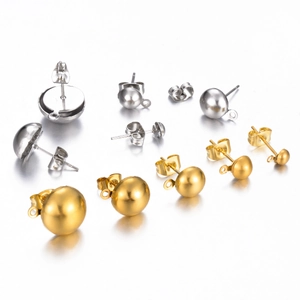 Close-up of gold and silver stainless steel ball earring studs with loops and backings