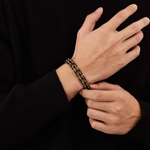 Detailed view of punk style black and gold stainless steel bike chain bracelet for men