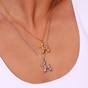 3D balloon dog pendant necklace in 18K gold and silver finishes on a delicate chain