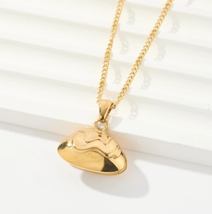 Elegant gold fan pendant necklace with wave texture on minimalist stepped background