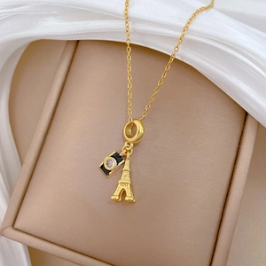 Titanium steel gold necklace with Eiffel Tower and black enamel camera charms in a gift box