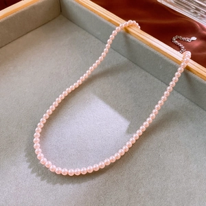 Detail of pink pearl necklace with S925 sterling silver extender chain and clasp