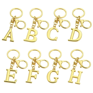 Golden metal alphabet keychain set with A to H letters featuring round rings and lobster clasps