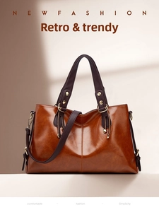 Brown leather shoulder bag for women, large capacity commuter handbag with contrast straps.