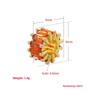 Detailed view of 18K gold plated bead with orange rhinestones and 9mm size specifications