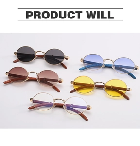 Flat lay of retro round sunglasses with metal frames and textured wood grain temples