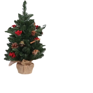 Mini Christmas tree with pine cones, red berries, and bells on a rustic burlap base