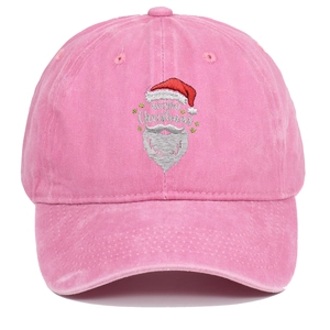 Detail showing Santa Claus embroidery and Merry Christmas text on pink washed cotton cap