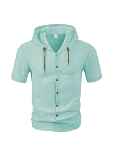 Detail of mint green cotton hooded shirt with drawstring and buttons on plain background