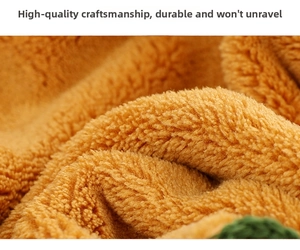Macro shot of thick warm yellow coral fleece fabric showing soft texture and stitching