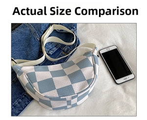 Blue and white checkered canvas crescent bag showing textile texture and size comparison