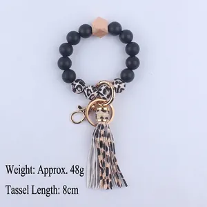 Silicone beaded bracelet keychain with leopard print tassel and gold ring, 48g weight