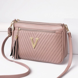 Stylish women's crossbody shoulder bag with metal V logo, multi-pocket PU leather design.