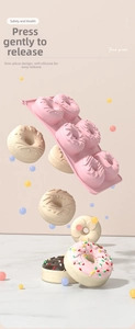 Macro view of 6-cavity pink silicone donut mold with heart and flower shapes