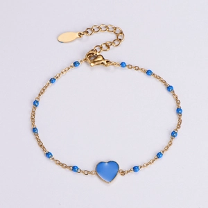 Detail of 18k gold plated heart bracelet with dark blue enamel and adjustable lobster clasp