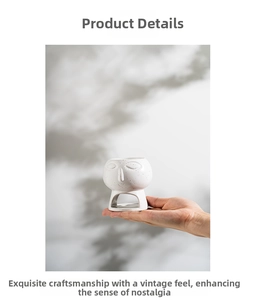 Macro shot of abstract face white ceramic oil burner showing mini size and vintage dots
