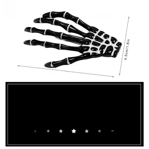 Detailed view of skeleton hand hair clip showing 7cm width and 4.5cm height dimensions