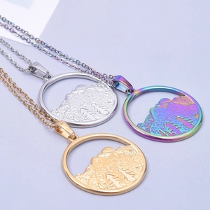 Detailed view of mountain pendants in silver, gold, and iridescent plating