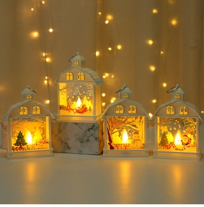 Set of four LED Christmas house lanterns with warm lights and festive themed graphics
