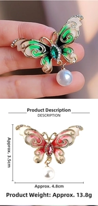 Macro view of vintage butterfly brooches with enamel and pearl pendant detail