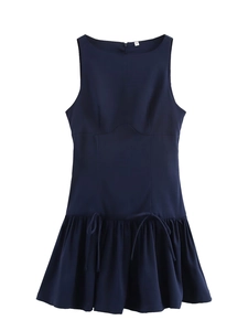 Detail of navy blue sleeveless dress featuring side drawstring ruching and woven fabric