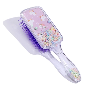 Detail of pink unicorn hairbrush with purple wavy bristles and colorful floating foam beads