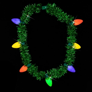 Detail of LED Christmas tree tinsel necklace with colorful glowing light bulbs