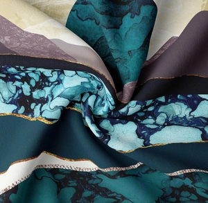 Detail of mountain tapestry with abstract marble textures and golden lines in spiral fold