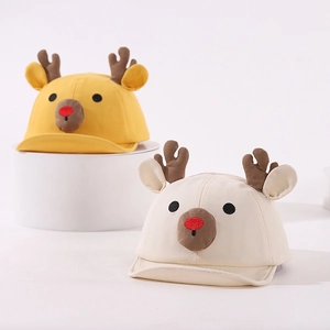 Cute baby baseball cap with cartoon reindeer antlers and soft brim in yellow and beige colors