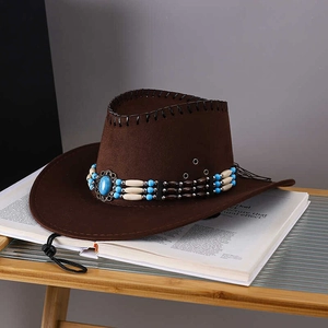 Detail of dark brown faux suede cowboy hat with vintage turquoise bead band and metal eyelets