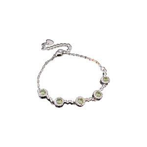 Elegant silver bracelet with five round green zircons and sparkling white stones