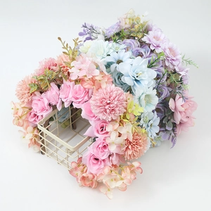 Close-up of colorful artificial flowers in a beige wire mesh basket for floral headwear