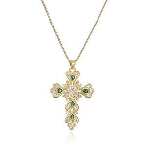 Gold plated cross necklace with emerald and clear zircon stones on a box chain
