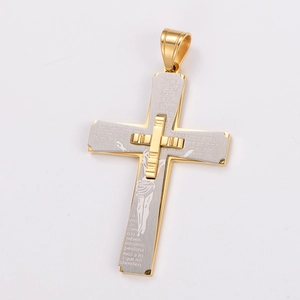 Detail of two-tone gold and silver cross pendant with engraved Spanish Lord's Prayer