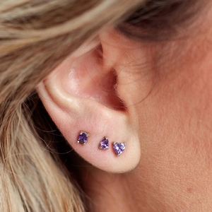 Three-piece purple zircon stud earrings set in silver claw setting for women