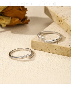 Macro detail of silver S925 minimalist open rings with sparkling stones and rose
