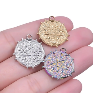 Handheld view of a 18k gold plated stainless steel goat star pendant necklace accessory
