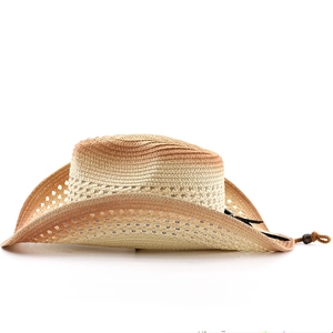 Detail of bohemian woven cowboy hat featuring gradient color and breathable hollow weave