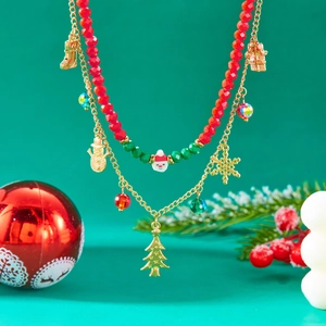 Detail of double-layer Christmas necklace with Santa, snowman, and tree charms