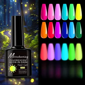 Close-up of 12-color glow-in-the-dark nail gel polish set under UV LED light