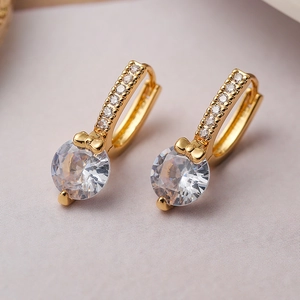 Gold plated geometric earrings with bow design and round zircon stone details