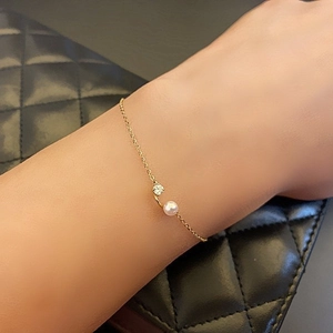 Minimalist S925 silver 18K gold plated bracelet with a white pearl and zircon on wrist