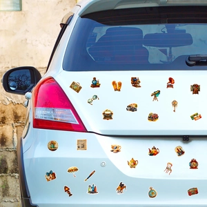 Close-up of vintage aesthetic stickers with classic cameras and cars on white car surface