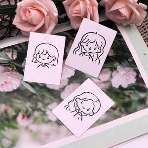 Pink paper earring display cards featuring minimalist cute girl line art illustrations