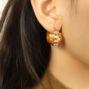 Minimalist 18K gold-plated C-shaped hoop earrings with oval white zircon inlays on model