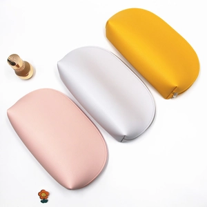Three-piece set of semi-circular PU leather makeup bags in pink, white, and yellow colors