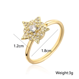 Macro shot of gold star ring showing 1.2cm diameter and 1.8cm inner band dimensions