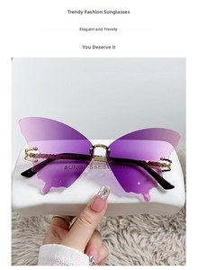Detail of gradient purple butterfly sunglasses with metal bridge and white hard case