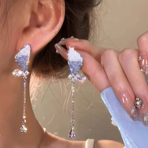 Silver needle butterfly tassel earrings with blue crystals and long dangling fringe style