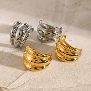 Modern triple-layered chunky hoop earrings in polished gold and silver stainless steel